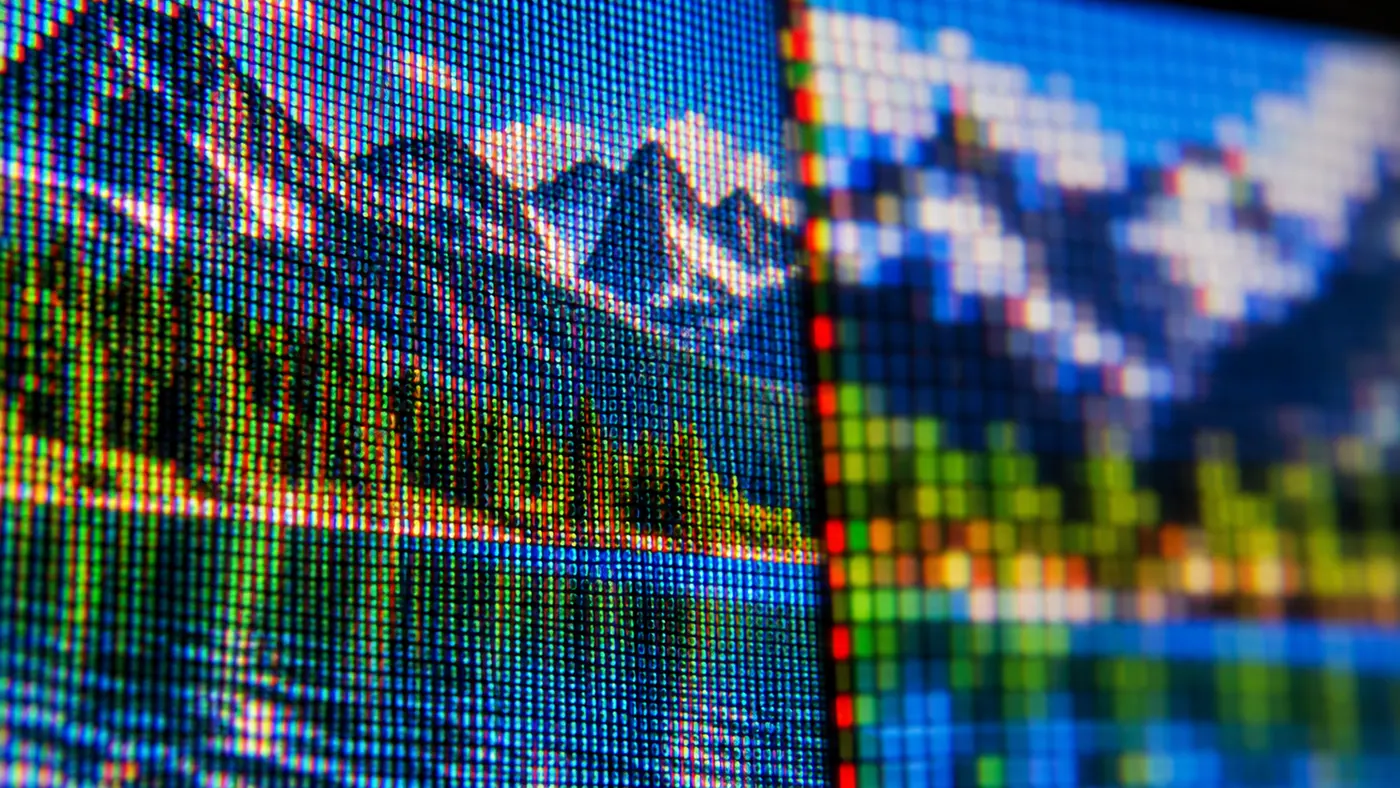The same landscape, half sharp and half made of large pixels (illustration)